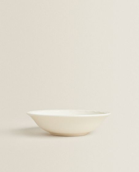 Earthenware bowl with raised-design edge