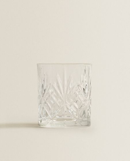 Crystalline tumbler with raised design