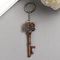 !09 Брелок металл "Ключ сплетённые сердца" бронза 7,5х2,6 см