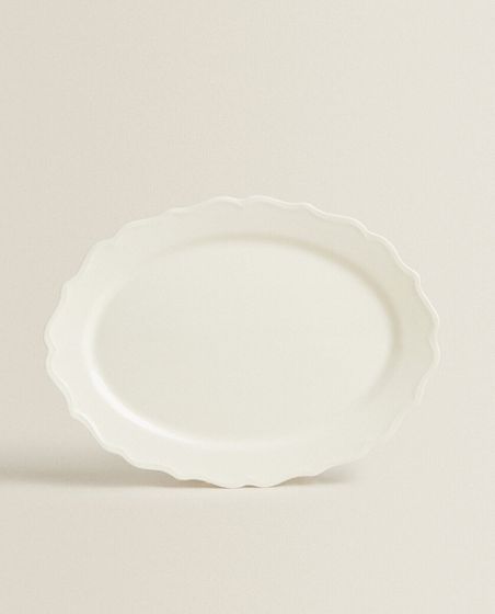 Earthenware serving dish with raised-design edge