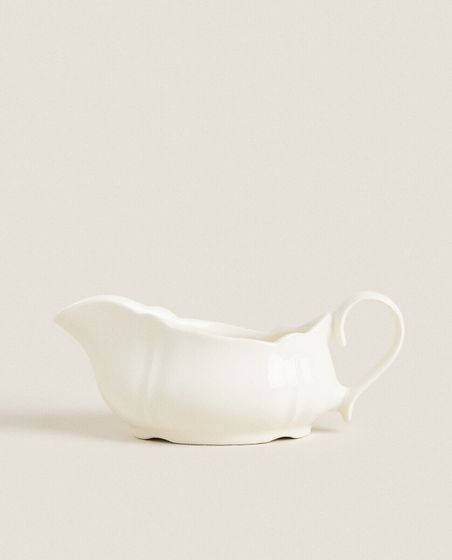 Earthenware gravy boat with raised-edge detail